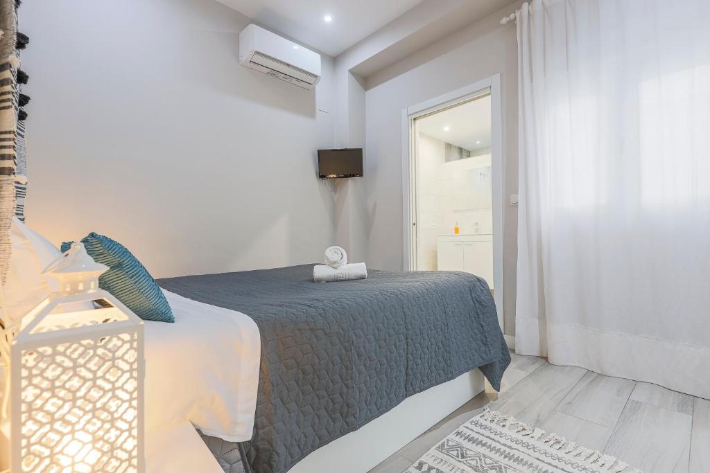 Łóżko lub łóżka w pokoju w obiekcie Minimalismo de Vanguardia con altas calidades 1 BR