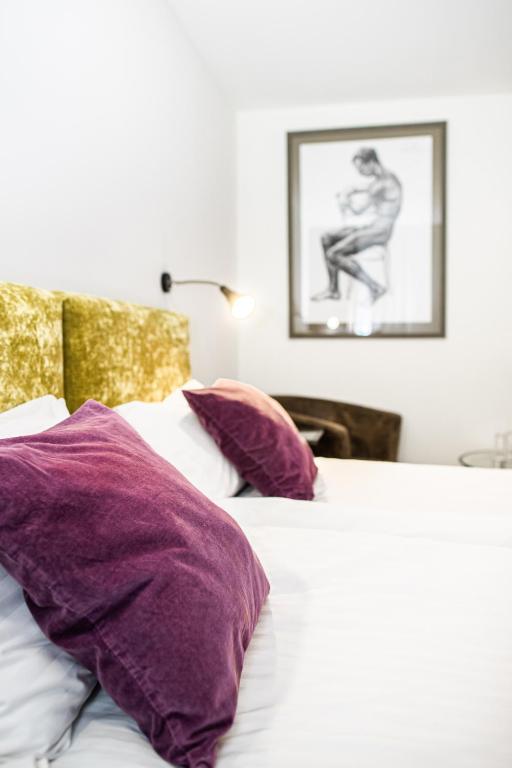 Postel nebo postele na pokoji v ubytování HOF HOTEL