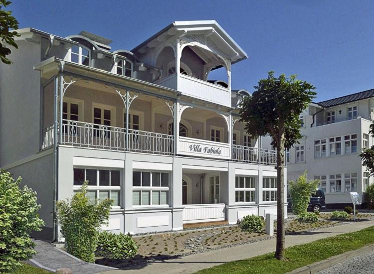 a large white building with a balcony at Villa Fabiola in Strandnähe in Binz