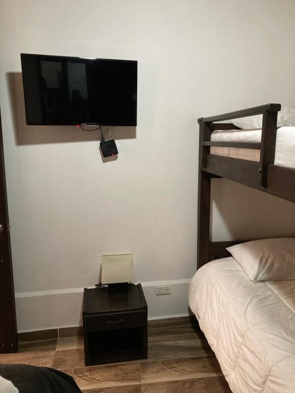 Postel nebo postele na pokoji v ubytování Hotel Boutique Colonial Cartago