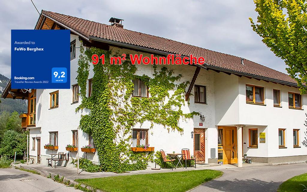 a building with a sign that reads m wolfgangride at FeWo Berghex in Pinswang
