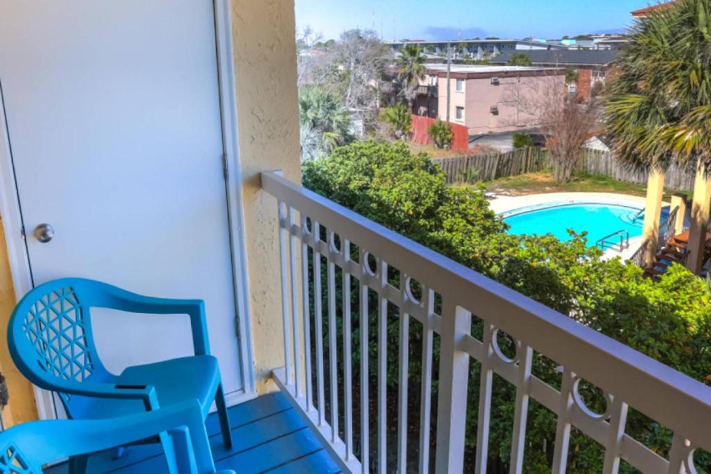 a balcony with a view of a swimming pool at Island Wind Unit 303 in Fort Walton Beach