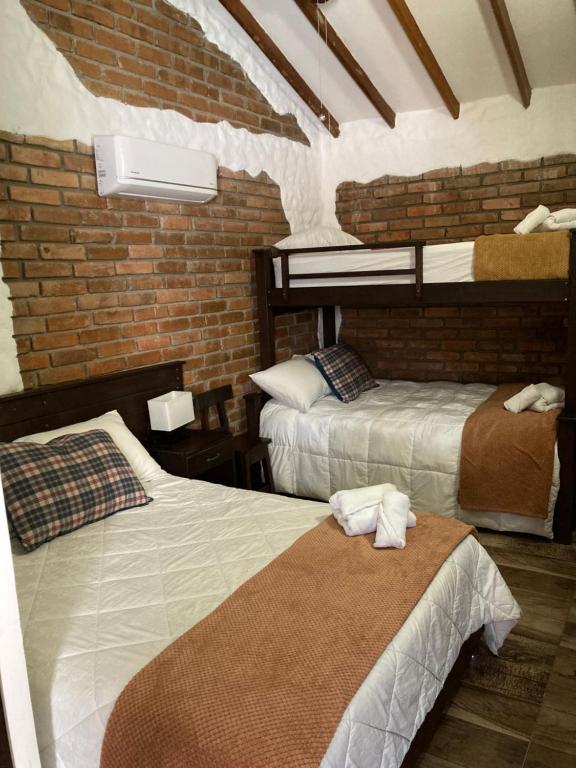 Postel nebo postele na pokoji v ubytování Hotel Boutique Colonial Cartago