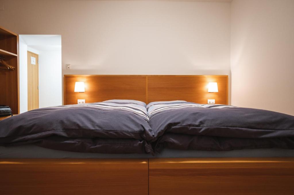 Postel nebo postele na pokoji v ubytování Hotel Stüa Granda