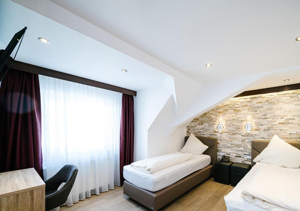 Postel nebo postele na pokoji v ubytování Central City Hotel