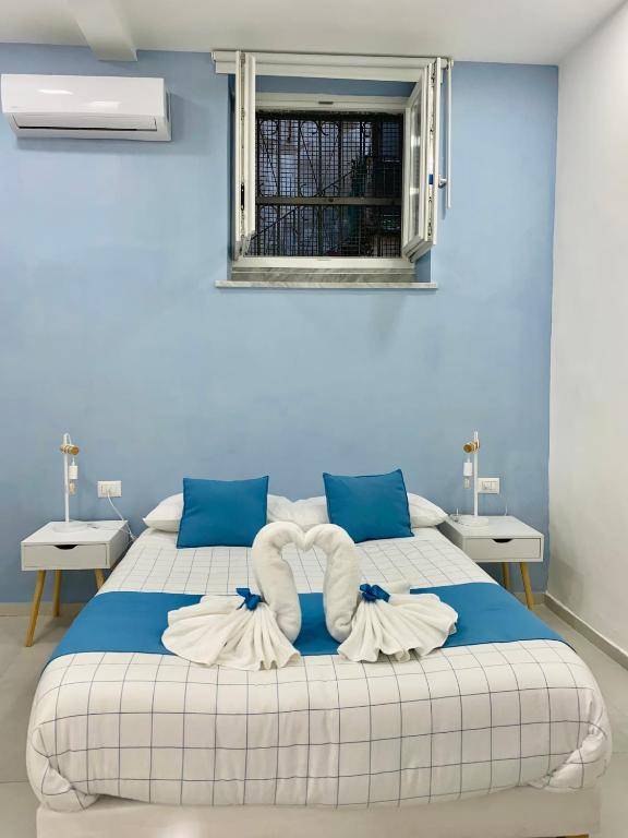 Posteľ alebo postele v izbe v ubytovaní Appartamento I Cenni di Napoli