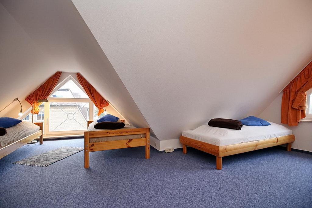 Postel nebo postele na pokoji v ubytování Villa Augusta Wohnung 13