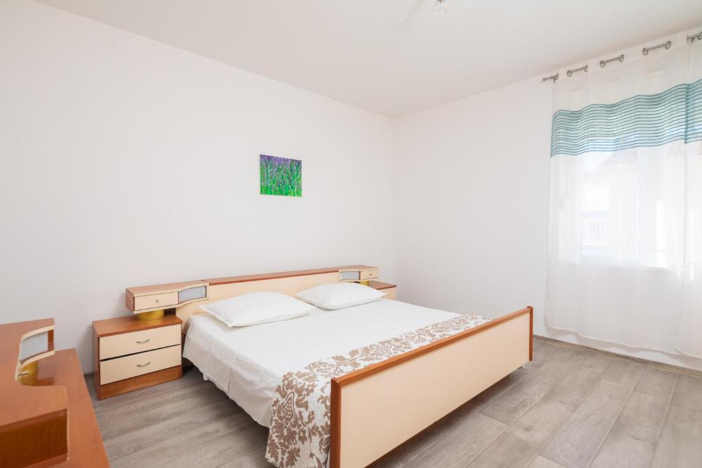Posteľ alebo postele v izbe v ubytovaní Seaside Apartment Tafra