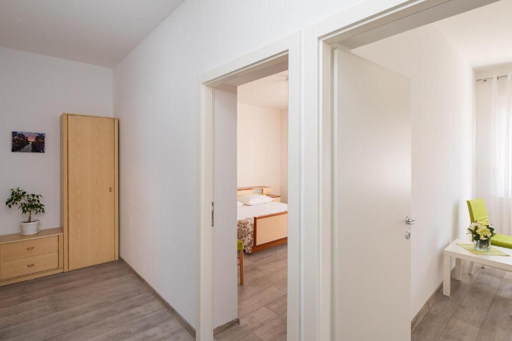 Posteľ alebo postele v izbe v ubytovaní Seaside Apartment Tafra