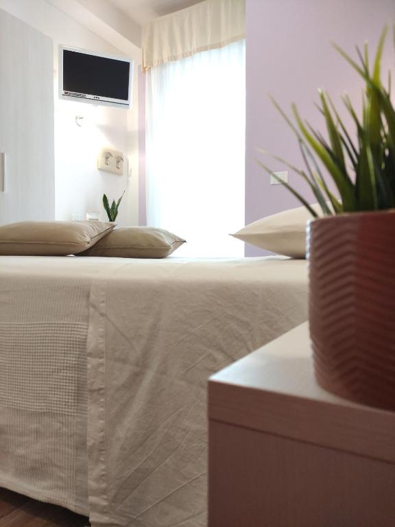 Postel nebo postele na pokoji v ubytování Hotel Galassia