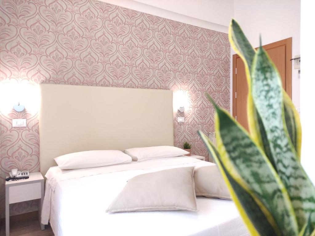 Postel nebo postele na pokoji v ubytování Hotel Galassia
