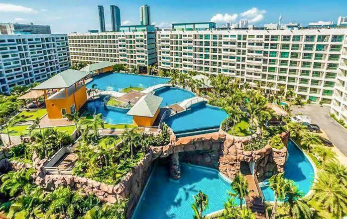 an aerial view of a resort with two water slides at Laguna beach condo resort 3 maldives pattaya pool view ลากูน่า บีช คอนโด รีสอร์ต 3 พัทยา in Jomtien Beach