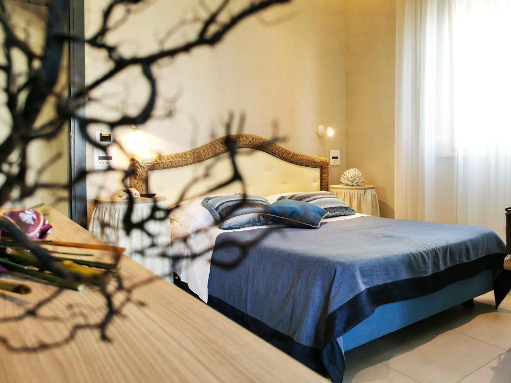 Postel nebo postele na pokoji v ubytování Hotel Alba