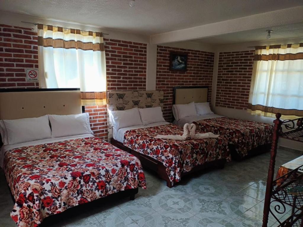 Postel nebo postele na pokoji v ubytování Hotel Fer
