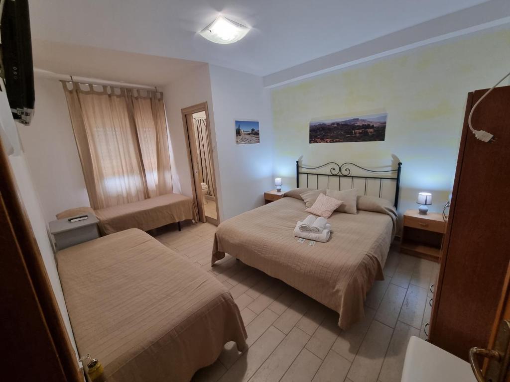 Postel nebo postele na pokoji v ubytování B&B Le Dune Beach