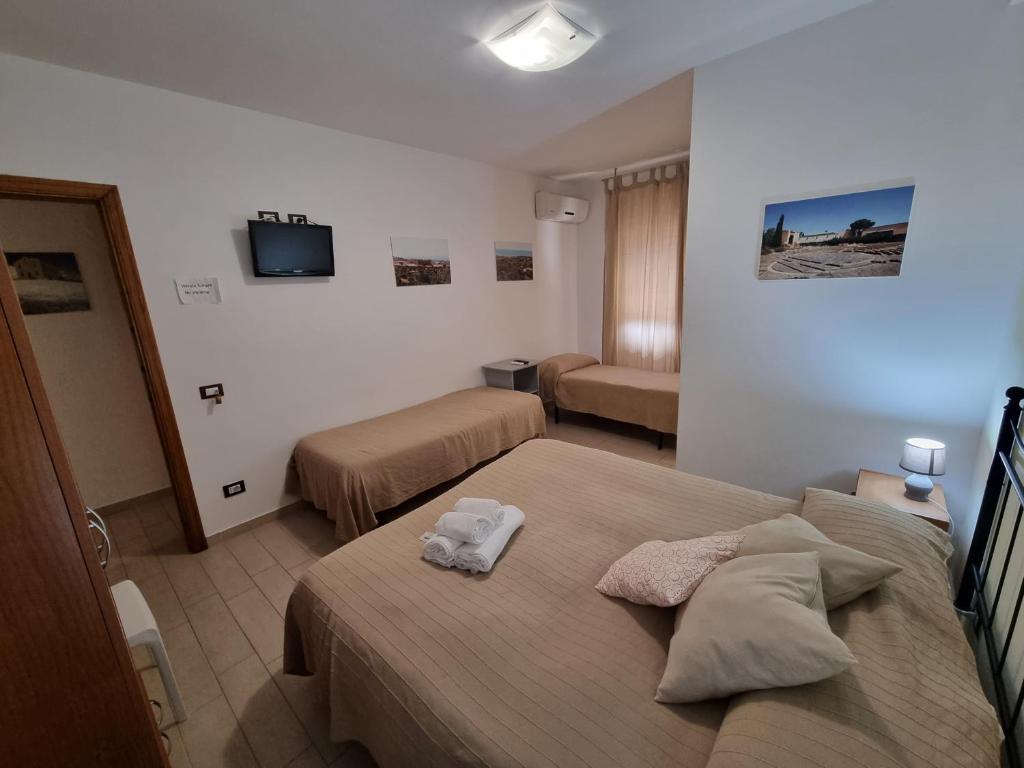 Postel nebo postele na pokoji v ubytování B&B Le Dune Beach