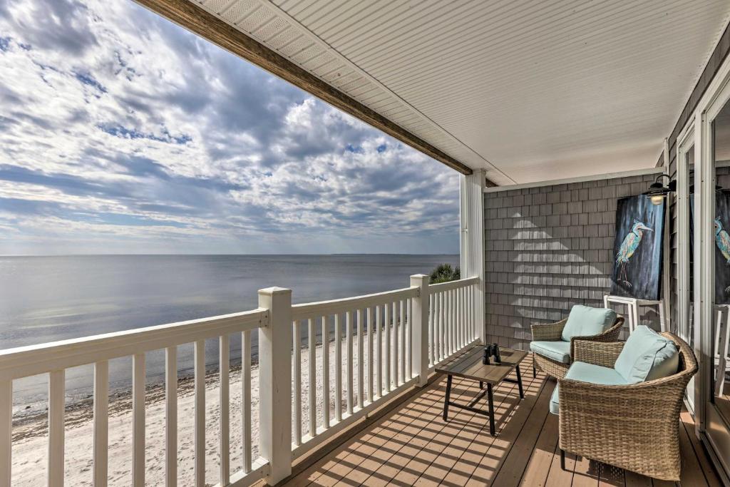 a balcony with a view of the ocean at Sunny Carabelle Outdoor Haven with Beach and Pier in Big Blackjack Landing