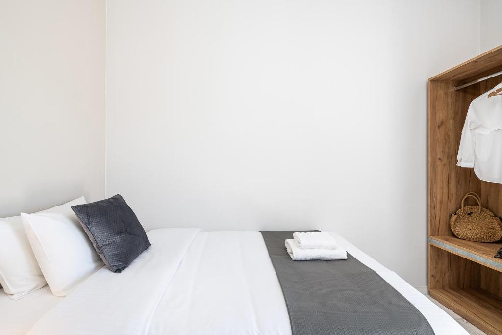 Posteľ alebo postele v izbe v ubytovaní West City Apartment