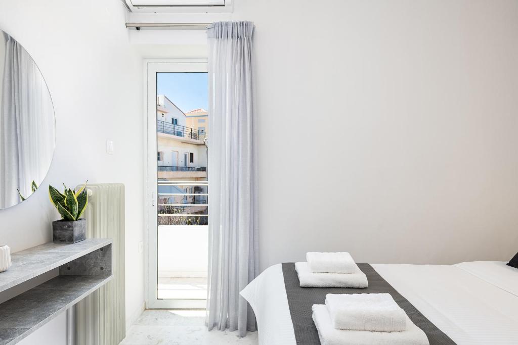 Posteľ alebo postele v izbe v ubytovaní West City Apartment