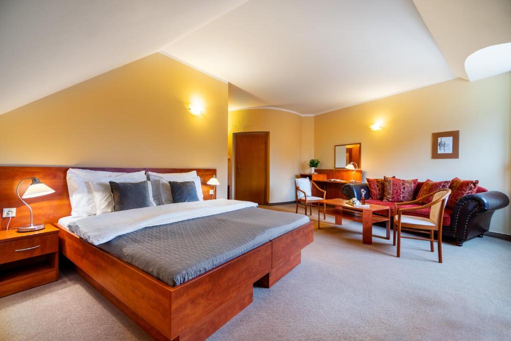 Postel nebo postele na pokoji v ubytování Hotel U Vlašského Dvora