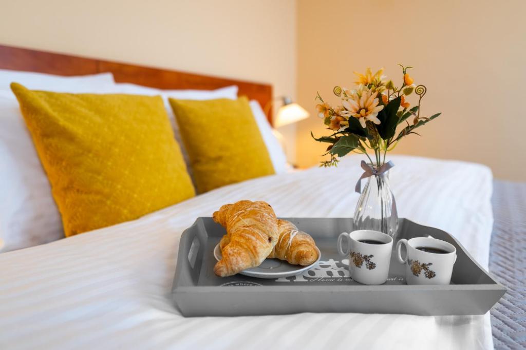Postel nebo postele na pokoji v ubytování Hotel U Vlašského Dvora