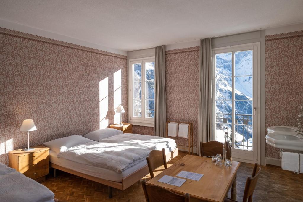 Postel nebo postele na pokoji v ubytování Hotel Regina