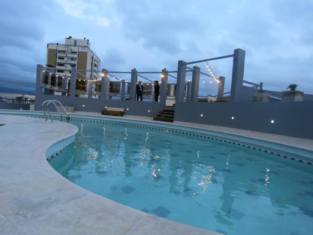 a swimming pool on the roof of a building at Vilaut Smart Flat in Córdoba