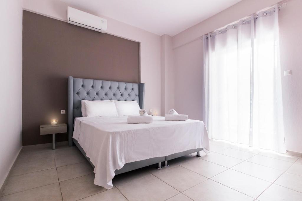 Кровать или кровати в номере Sueño Luxury Apartments