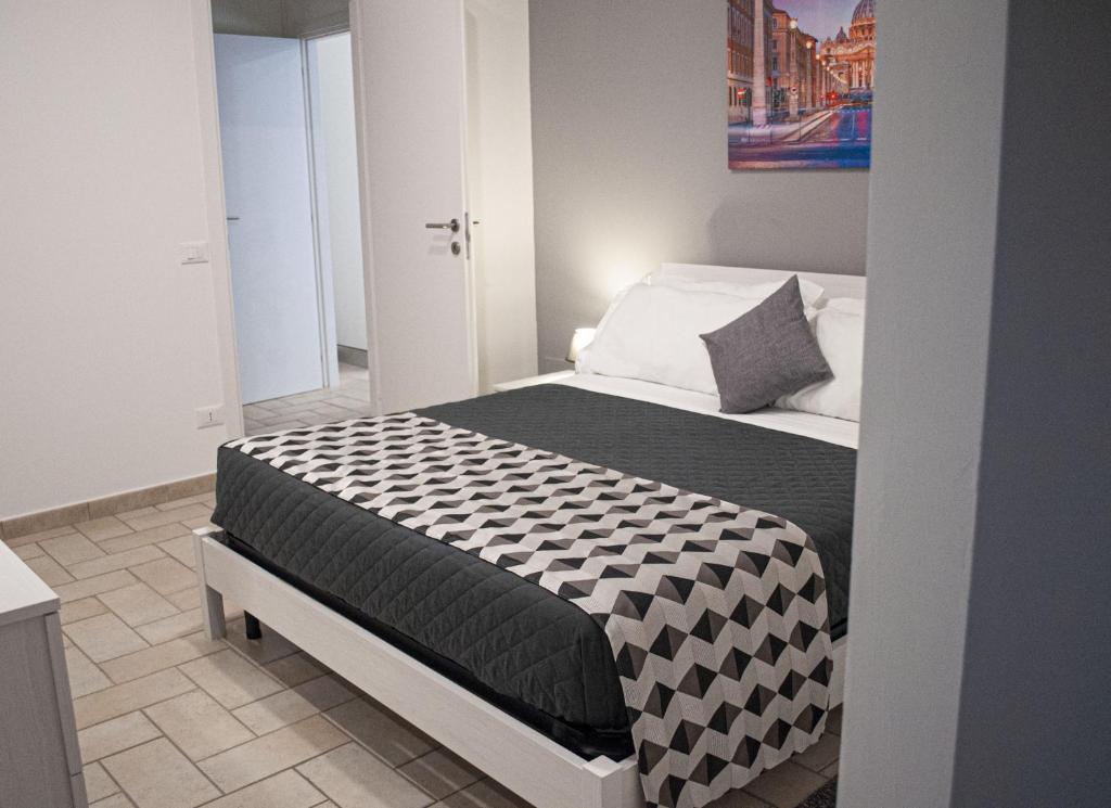 A bed or beds in a room at Borgo San Lorenzo Roma