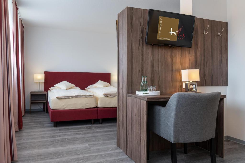 Postel nebo postele na pokoji v ubytování Hotel Grosse Klus