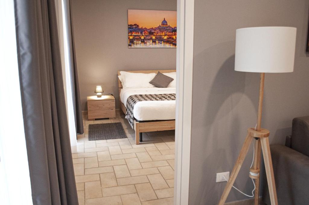 A bed or beds in a room at Borgo San Lorenzo Roma