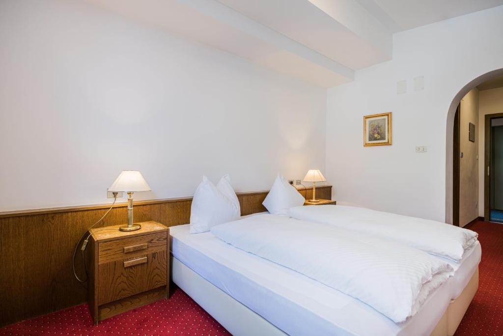 Postel nebo postele na pokoji v ubytování Hotel Waldheim