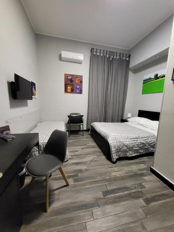 Postel nebo postele na pokoji v ubytování Caio Duilio B&B