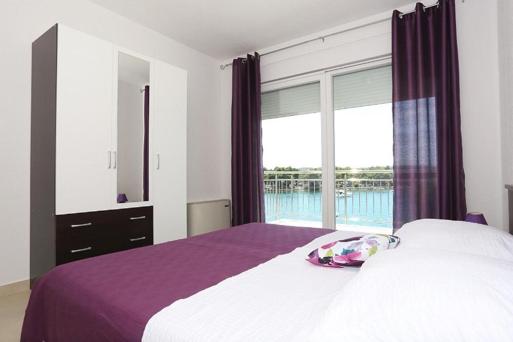 Posteľ alebo postele v izbe v ubytovaní Apartments Dado Trogir
