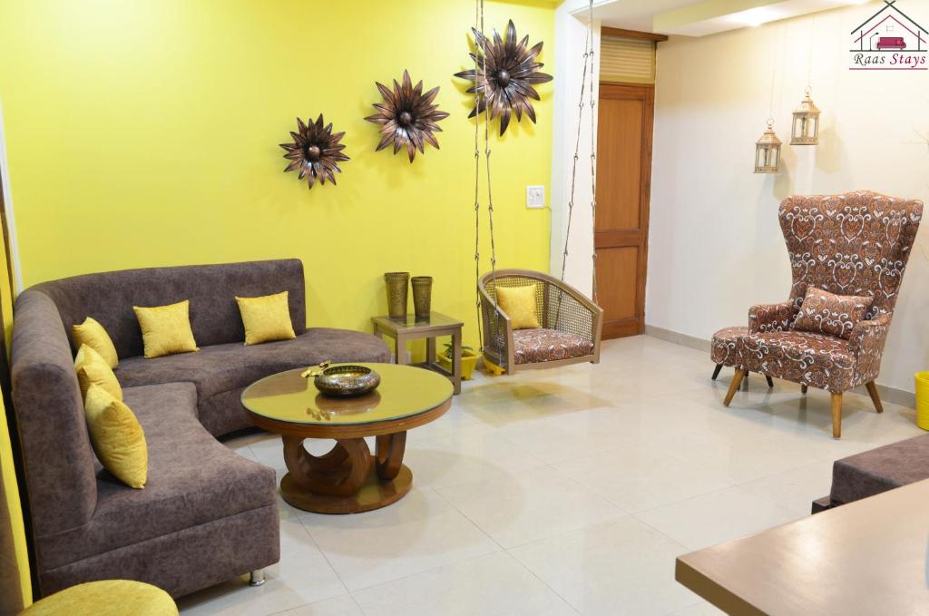 a living room with a couch and chairs and a table at Furnished 2BHK Independent Apartment 8 in Greater Kailash - 1 with 2 Balconies in New Delhi