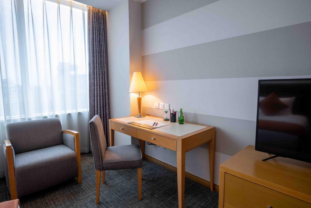 TV a/nebo společenská místnost v ubytování Shanghai Tiancheng Hotel