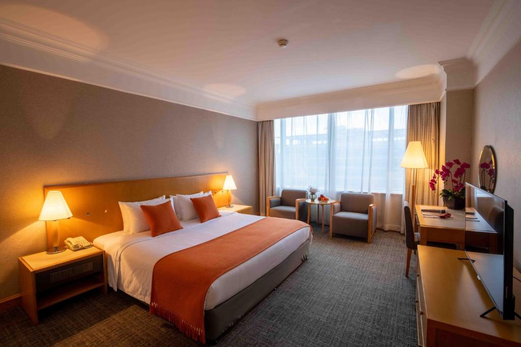 Postel nebo postele na pokoji v ubytování Shanghai Tiancheng Hotel