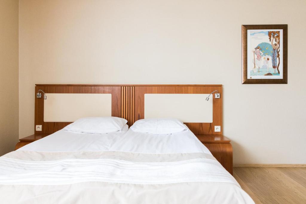 Posteľ alebo postele v izbe v ubytovaní Hotel Osada Karbówko Wellness & SPA