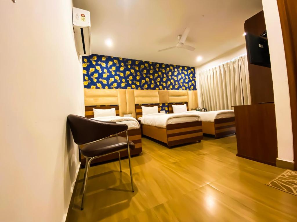 Postel nebo postele na pokoji v ubytování Sky Suites