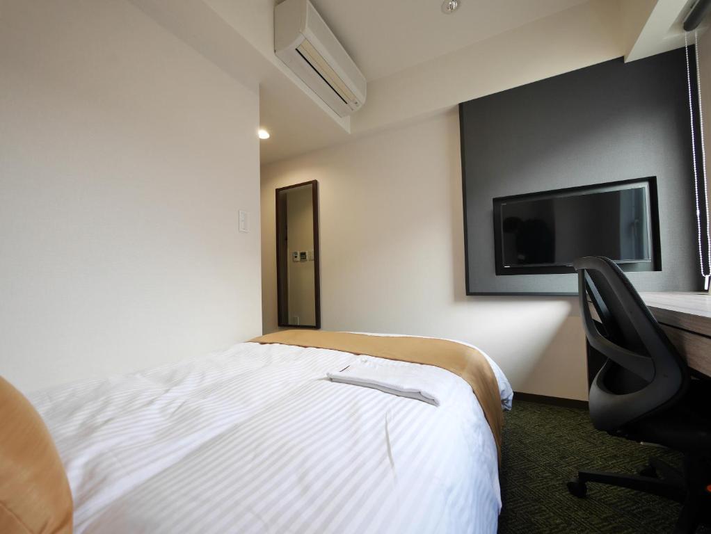 Postel nebo postele na pokoji v ubytování Hotel Comfybed Ginza