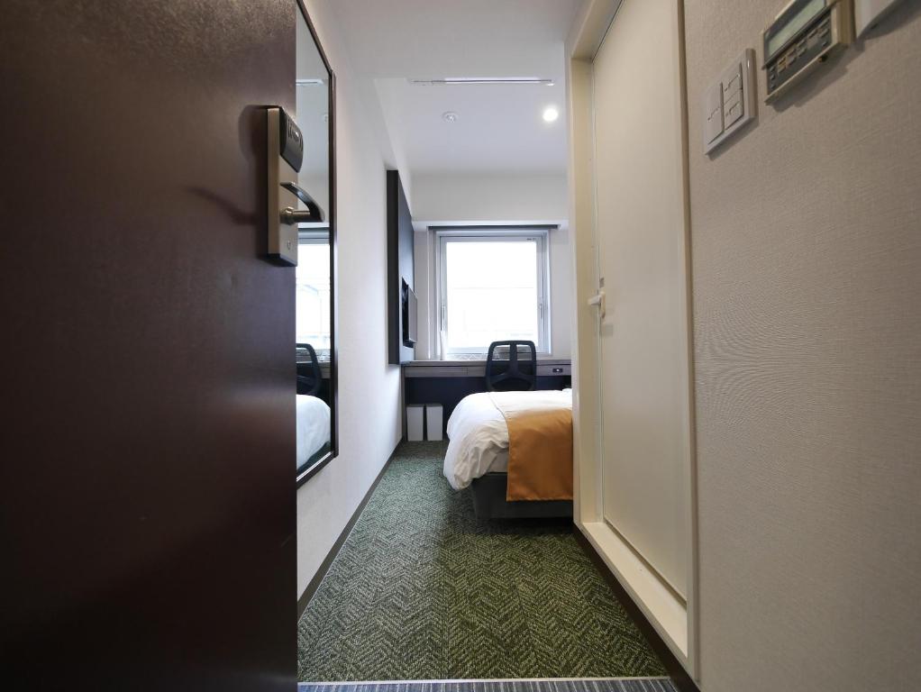 Postel nebo postele na pokoji v ubytování Hotel Comfybed Ginza