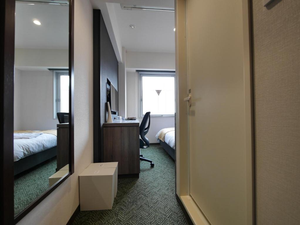 Postel nebo postele na pokoji v ubytování Hotel Comfybed Ginza