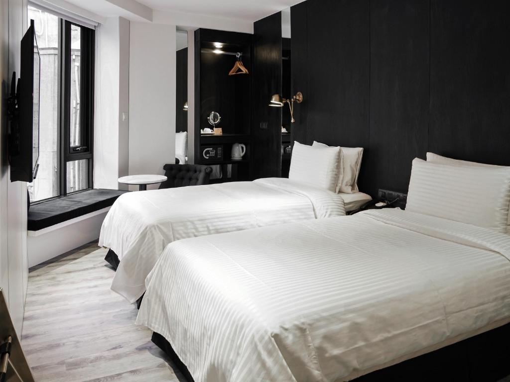 Voodi või voodid majutusasutuse Hotel Relax III toas