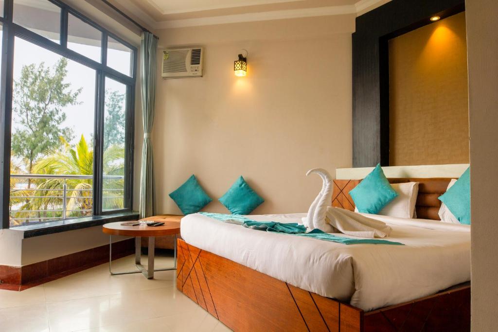 Postel nebo postele na pokoji v ubytování Hotel Sonar Bangla Mandarmoni