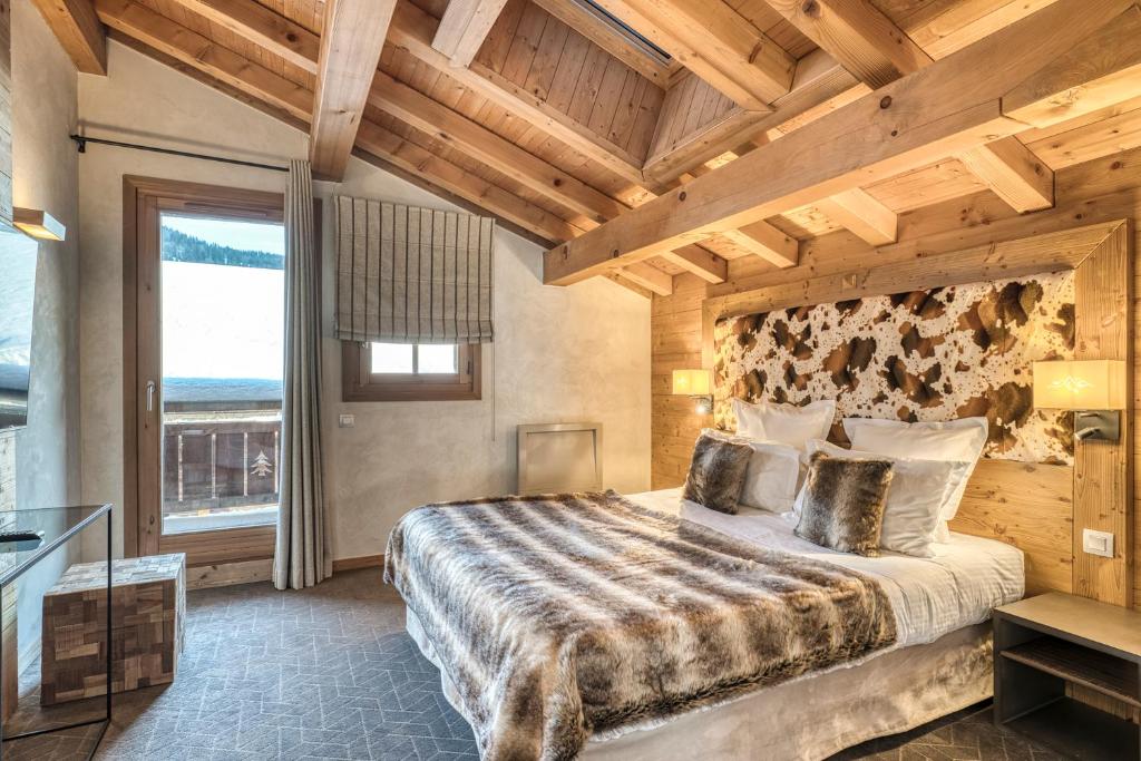 Postel nebo postele na pokoji v ubytování Les Loges Blanches Megève