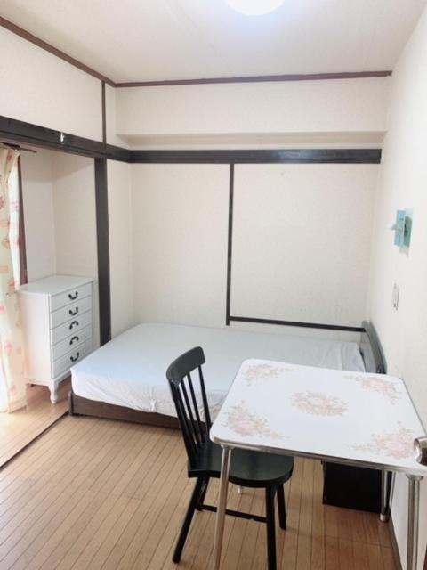 Postel nebo postele na pokoji v ubytování Tokyo Kakan