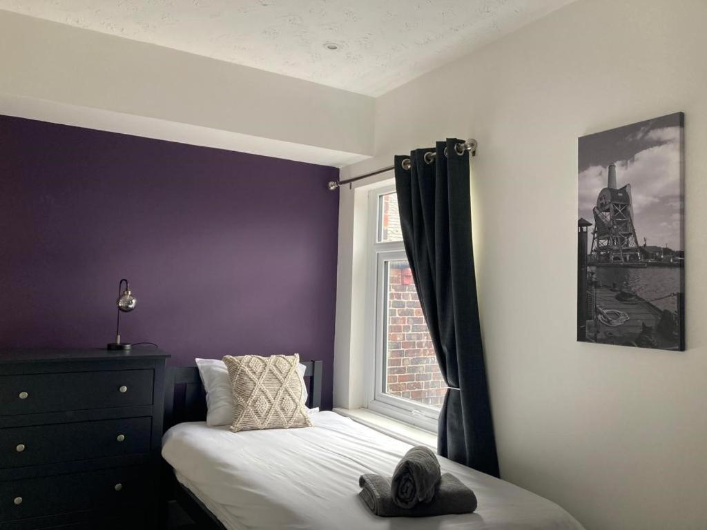 a bedroom with a bed and a window at The Dockyard in Goole