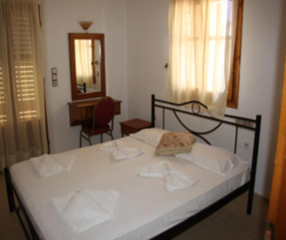 Postel nebo postele na pokoji v ubytování Dimitris Apartments
