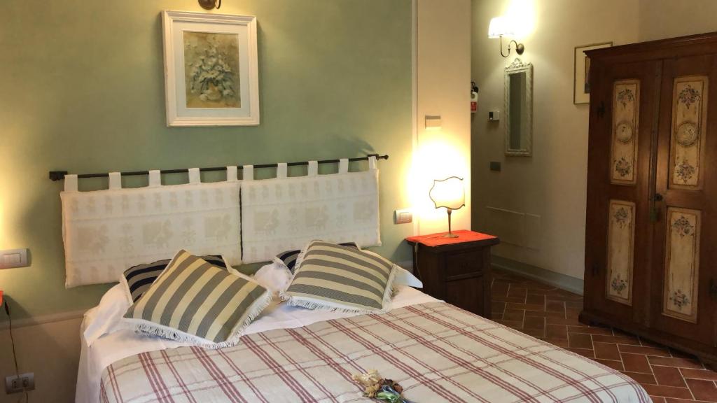 Posteľ alebo postele v izbe v ubytovaní La Cantina Relais - Fattoria Il Cipresso