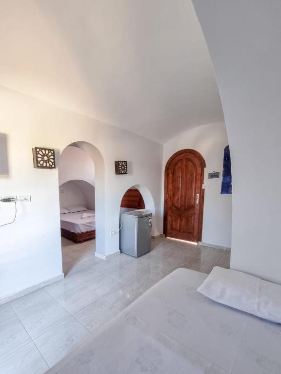 Postel nebo postele na pokoji v ubytování Coral Reefs Hotel Dahab